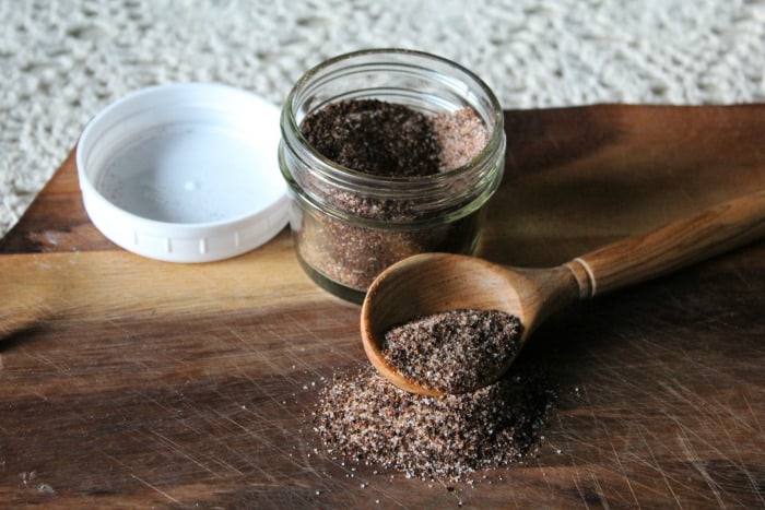 coffee spice rub in jar spilled out with spoon